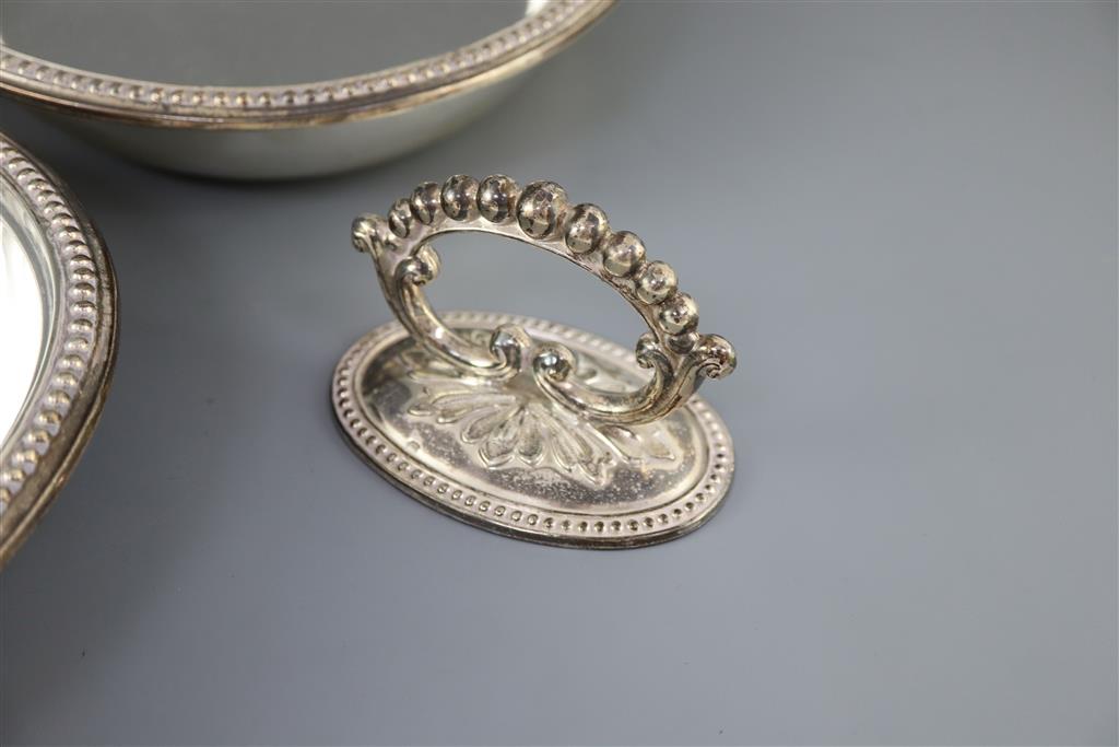 A pair of late Victorian silver oval entree dishes and covers with handles, by Mappin & Webb,